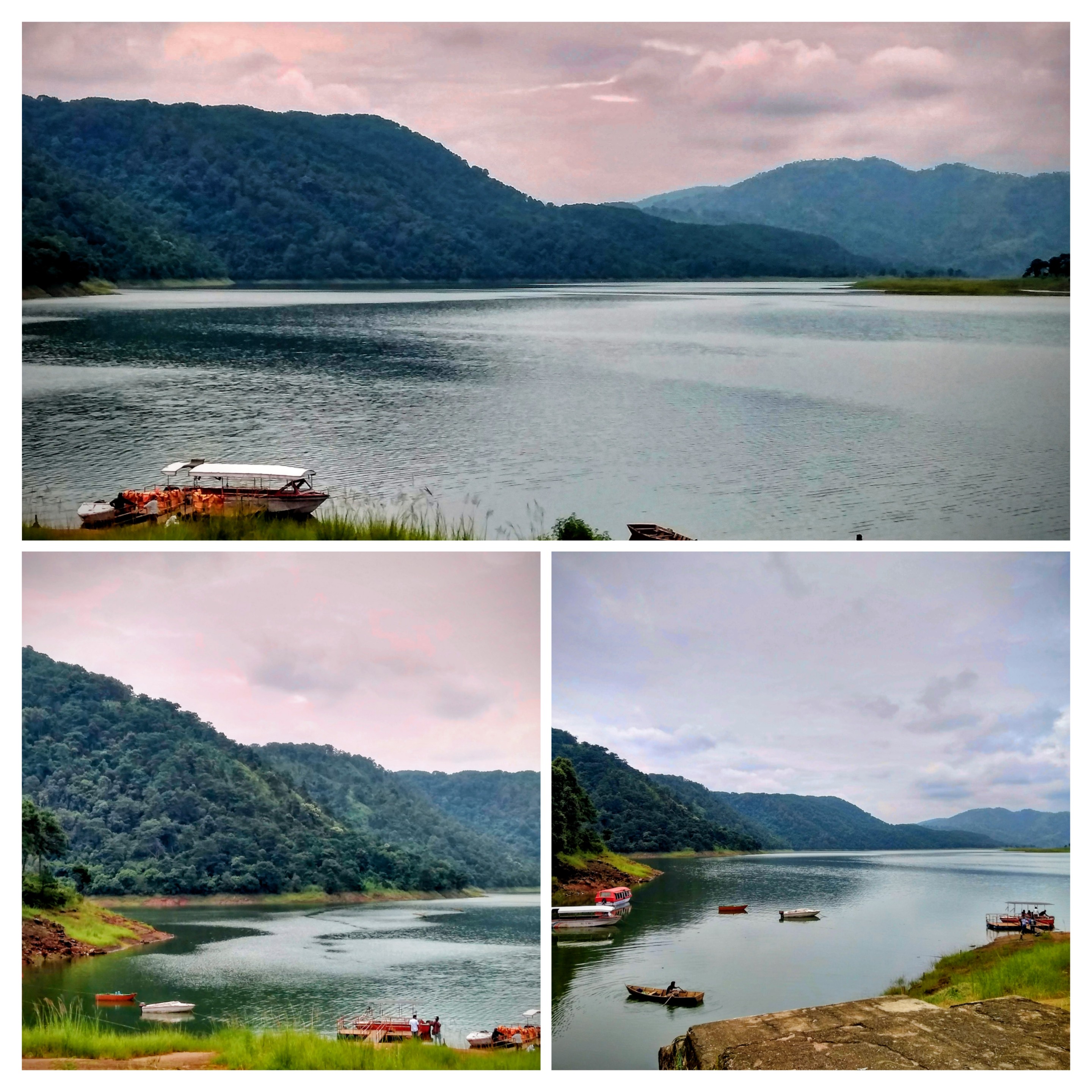 A vast, calm lake surrounded by deep green rolling hills under a soft sky